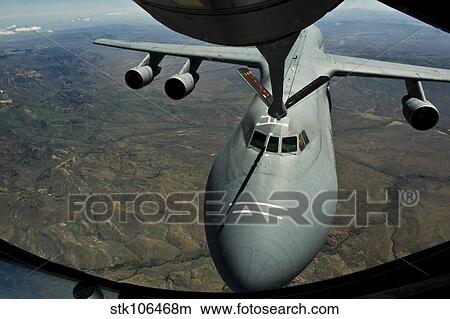 A U. S. Air Force KC-135R Stratotanker aircraft refuels a C-5B Galaxy. View Large Photo Image Picture - A U. S. Air Force KC-135R Stratotanker aircraft refuels a C-5B Galaxy.. Fotosearch