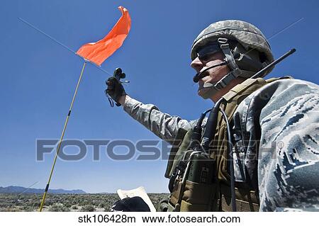 A U. S. Air Force member uses anemometers to measure wind speed. View Large Photo Image Picture - A U. S. Air Force member uses anemometers to measure wind speed.. Fotosearch