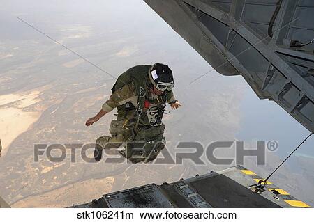 A U. S. Air Force pararescueman jumps from a CH-53E Super Stallion. View Large Photo Image Picture - A U. S. Air Force pararescueman jumps from a CH-53E Super Stallion.. Fotosearch