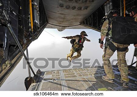 Picture - A U. S. Air Force pararescueman jumps out of an HC-130P Combat King aircraft.. Fotosearch