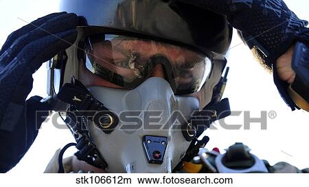 A U. S. Airman secures his oxygen mask. View Large Photo Image Picture - A U. S. Airman secures his oxygen mask.. Fotosearch