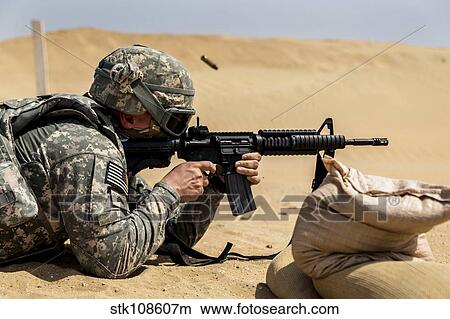 A U. S. Army National Guardsman at a firing range. View Large Photo Image Picture - A U. S. Army National Guardsman at a firing range.. Fotosearch