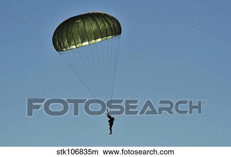 A U. S. Army paratrooper participates in a personnel drop. View Large Photo Image Picture - A U. S. Army paratrooper participates in a personnel drop.. Fotosearch