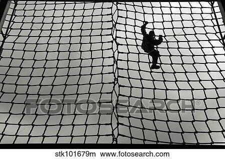 Picture - A U. S. Army Soldier makes her way down the rope ladder at Victory Tower.. Fotosearch