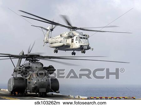 A U. S. Marine Corps CH-53E Sea Stallion helicopter taking off from USS Essex in the Sea of Japan. View Large Photo Image Picture - A U. S. Marine Corps CH-53E Sea Stallion helicopter taking off from USS Essex in the Sea of Japan. . Fotosearch