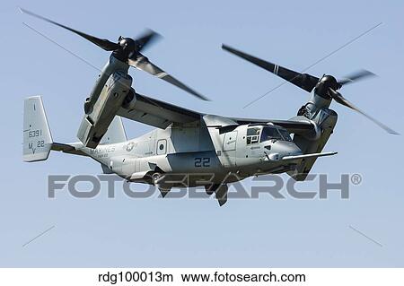 A U. S. Marine Corps V-22 Osprey transitions to wingborne flight. View Large Photo Image Picture - A U. S. Marine Corps V-22 Osprey transitions to wingborne flight.. Fotosearch
