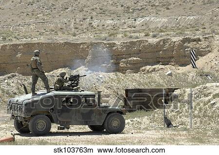 A U. S. Marine fires a Mark 19-3 40mm grenade launcher during Javelin Thrust 2010. View Large Photo Image Picture - A U. S. Marine fires a Mark 19-3 40mm grenade launcher during Javelin Thrust 2010.. Fotosearch