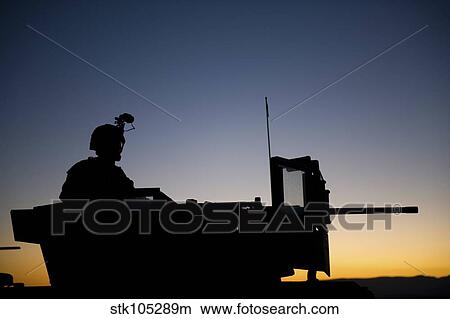 A U. S. Marine keeps watch during a security halt. View Large Photo Image Picture - A U. S. Marine keeps watch during a security halt.. Fotosearch