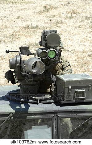 A U. S. Marine looks though the optics of a BGM-71 TOW anti-tank guided missile. View Large Photo Image Picture - A U. S. Marine looks though the optics of a BGM-71 TOW anti-tank guided missile.. Fotosearch