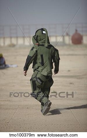 A U. S. Marine tries running in a bomb suit. View Large Photo Image Picture - A U. S. Marine tries running in a bomb suit.. Fotosearch