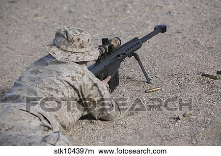 A U. S. Marine zeros his M107 sniper rifle. View Large Photo Image Picture - A U. S. Marine zeros his M107 sniper rifle.. Fotosearch