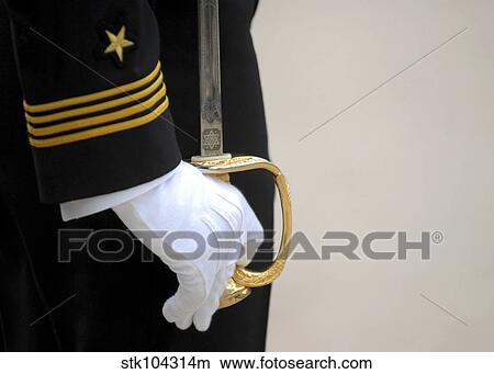Picture - A U. S. Naval Academy midshipman stands at attention.. Fotosearch