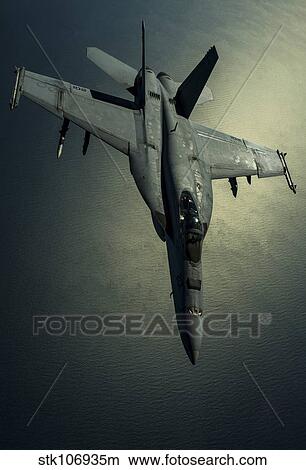 A U. S. Navy F/A-18E Hornet over Southwest Asia. View Large Photo Image Picture - A U. S. Navy F/A-18E Hornet over Southwest Asia.. Fotosearch