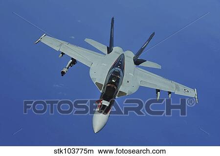 Picture - A U. S. Navy F/A-18F Super Hornet in flight near Joint Base Pearl Harbor-Hickam, Hawaii.. Fotosearch