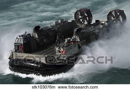 A U. S. Navy Landing Craft Air Cushion heading to the Kuwait Naval Base. View Large Photo Image Picture - A U. S. Navy Landing Craft Air Cushion heading to the Kuwait Naval Base.. Fotosearch