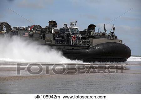 Picture - A U. S. Navy landing craft air cushion glides onto a Moroccan beach.. Fotosearch
