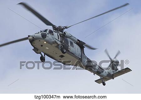 Picture - A U. S. Navy MH-60S Seahawk in flight over Coronado, California.. Fotosearch