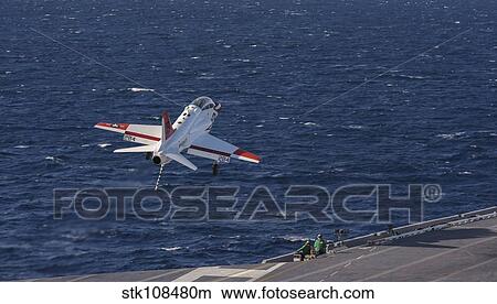 A U. S. Navy T-45C Goshawk performs a touch-and-go landing. View Large Photo Image Picture - A U. S. Navy T-45C Goshawk performs a touch-and-go landing.. Fotosearch