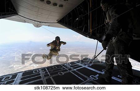A U. S. Soldier conducts a training jump from an HC-130P Combat King. View Large Photo Image Picture - A U. S. Soldier conducts a training jump from an HC-130P Combat King.. Fotosearch