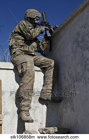 A U. S. Soldier provides security at an outpost in Afghanistan. View Large Photo Image Picture - A U. S. Soldier provides security at an outpost in Afghanistan.. Fotosearch