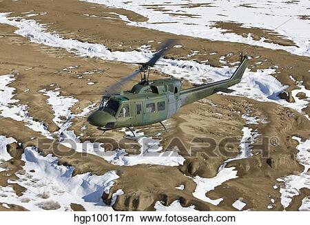 A UH-1N Twin Huey near Kirtland Air Force Base, New Mexico. View Large Photo Image Picture - A UH-1N Twin Huey near Kirtland Air Force Base, New Mexico.. Fotosearch
