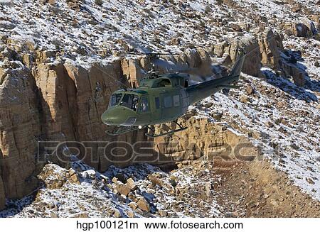 A UH-1N Twin Huey near Kirtland Air Force Base, New Mexico. View Large Photo Image Picture - A UH-1N Twin Huey near Kirtland Air Force Base, New Mexico.. Fotosearch