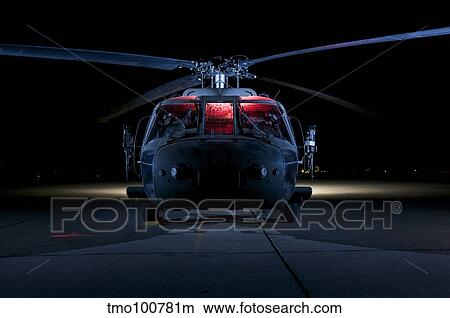 A UH-60 Black Hawk helicopter lit up by multiple external flash units. View Large Photo Image Picture - A UH-60 Black Hawk helicopter lit up by multiple external flash units.. Fotosearch