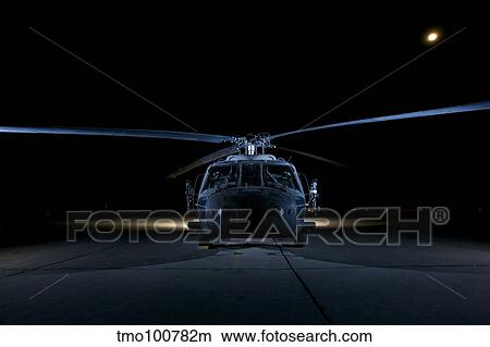 A UH-60 Black Hawk helicopter lit up by multiple external flash units. View Large Photo Image Picture - A UH-60 Black Hawk helicopter lit up by multiple external flash units.. Fotosearch