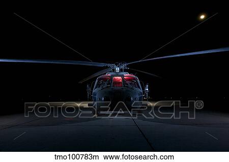 A UH-60 Black Hawk helicopter lit up by multiple external flash units. View Large Photo Image Picture - A UH-60 Black Hawk helicopter lit up by multiple external flash units.. Fotosearch