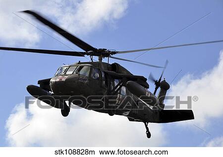 A UH-60 Black Hawk helicopter taking off. View Large Photo Image Picture - A UH-60 Black Hawk helicopter taking off.. Fotosearch