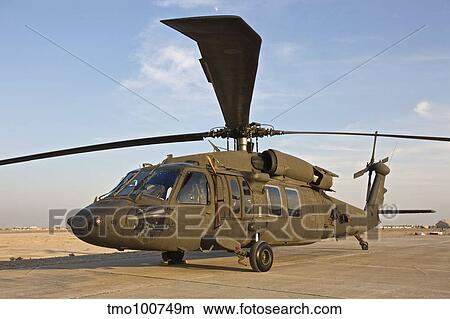A UH-60 Black Hawk parked at a military base in Tikrit, Iraq. View Large Photo Image Picture - A UH-60 Black Hawk parked at a military base in Tikrit, Iraq.. Fotosearch