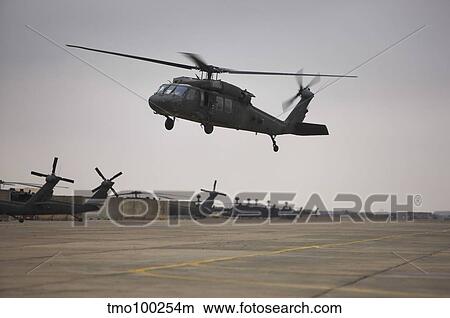 A UH-60 Black Hawk taking off for a mission over northern Iraq. View Large Photo Image Picture - A UH-60 Black Hawk taking off for a mission over northern Iraq.. Fotosearch