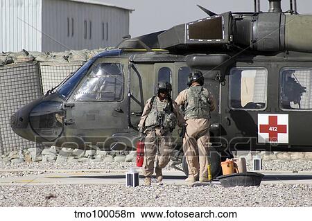 A UH-60 Blackhawk Medivac helicopter refuels at Camp Warhorse after a mission. View Large Photo Image Picture - A UH-60 Blackhawk Medivac helicopter refuels at Camp Warhorse after a mission.. Fotosearch