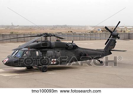 A UH-60 Blackhawk Medivac helicopter sits on the flight deck at Camp Warhorse. View Large Photo Image Picture - A UH-60 Blackhawk Medivac helicopter sits on the flight deck at Camp Warhorse.. Fotosearch