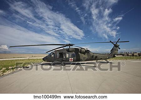 A UH-60L Blackhawk parked on its pad in Kunduz, Afghanistan. View Large Photo Image Picture - A UH-60L Blackhawk parked on its pad in Kunduz, Afghanistan.. Fotosearch