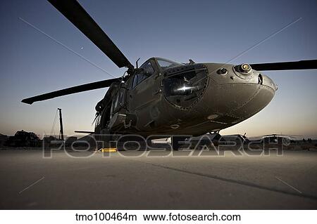 A UH-60L Blackhawk parked on its pad. View Large Photo Image Picture - A UH-60L Blackhawk parked on its pad.. Fotosearch