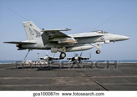 A US Navy F/A-18E Super Hornet prepares to land aboard USS Eisenhower. View Large Photo Image Picture - A US Navy F/A-18E Super Hornet prepares to land aboard USS Eisenhower.. Fotosearch