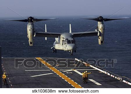 A V-22 Osprey aircraft prepares to land aboard the USS Bataan in the Atlantic Ocean. View Large Photo Image Picture - A V-22 Osprey aircraft prepares to land aboard the USS Bataan in the Atlantic Ocean.. Fotosearch