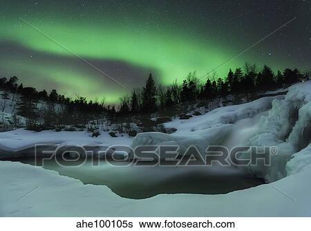 A wintery waterfall and aurora borealis over Tennevik River, Norway. View Large Photo Image Stock Photograph - A wintery waterfall and aurora borealis over Tennevik River, Norway.. Fotosearch