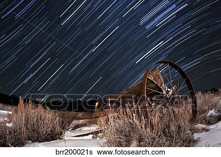 Abandoned farm equipment against a backdrop of star trails. View Large Photo Image Stock Photograph - Abandoned farm equipment against a backdrop of star trails.. Fotosearch