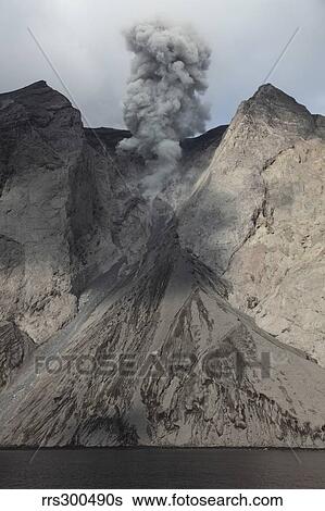 Active crater and debris slope below at Batu Tara volcano, Indonesia. View Large Photo Image Stock Photograph - Active crater and debris slope below at Batu Tara volcano, Indonesia.. Fotosearch