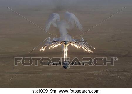 Aerial shot over Iraq of a KC-130 Stratotanker firing flares. View Large Photo Image Picture - Aerial shot over Iraq of a KC-130 Stratotanker firing flares.. Fotosearch