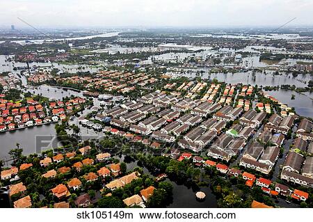 Aerial view of flood waters affecting an area of Thailand. View Large Photo Image Picture - Aerial view of flood waters affecting an area of Thailand.. Fotosearch