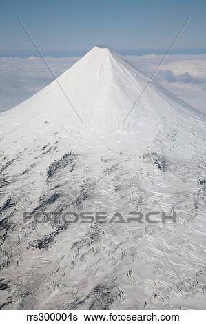 Aerial view of glaciated Shishaldin Volcano, Unimak Island, Alaska. View Large Photo Image Stock Photograph - Aerial view of glaciated Shishaldin Volcano, Unimak Island, Alaska.. Fotosearch