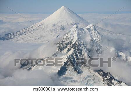 Aerial view of Shishaldin Volcano, with Isanotski Peaks in foreground, Alaska. View Large Photo Image Stock Photograph - Aerial view of Shishaldin Volcano, with Isanotski Peaks in foreground, Alaska.. Fotosearch