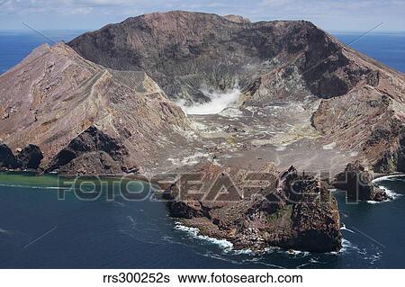 Stock Photograph - Aerial view of White Island volcano with central acidic crater lake, Bay of Plenty, New Zealand.. Fotosearch