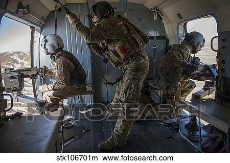 Afghan Air Force members inside of a Mi-17 helicopter. View Large Photo Image Picture - Afghan Air Force members inside of a Mi-17 helicopter.. Fotosearch