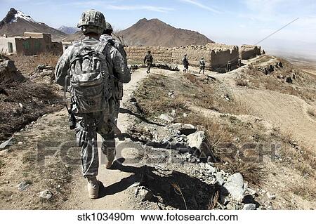 Afghan National Army and U. S. soldiers patrol the village of Akbar Kheyl, Afghanistan. View Large Photo Image Picture - Afghan National Army and U. S. soldiers patrol the village of Akbar Kheyl, Afghanistan.. Fotosearch