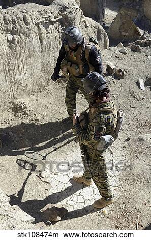 Afghan National Security Forces members search for IED's. View Large Photo Image Picture - Afghan National Security Forces members search for IED's.. Fotosearch