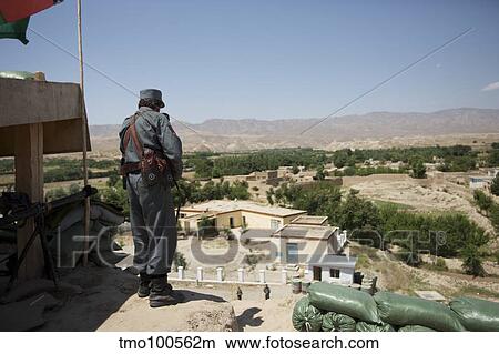Afghan policeman standing at his checkpoint. View Large Photo Image Picture - Afghan policeman standing at his checkpoint.. Fotosearch